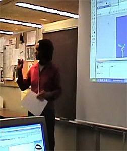 Marilyn McNeal standing at the projection screen